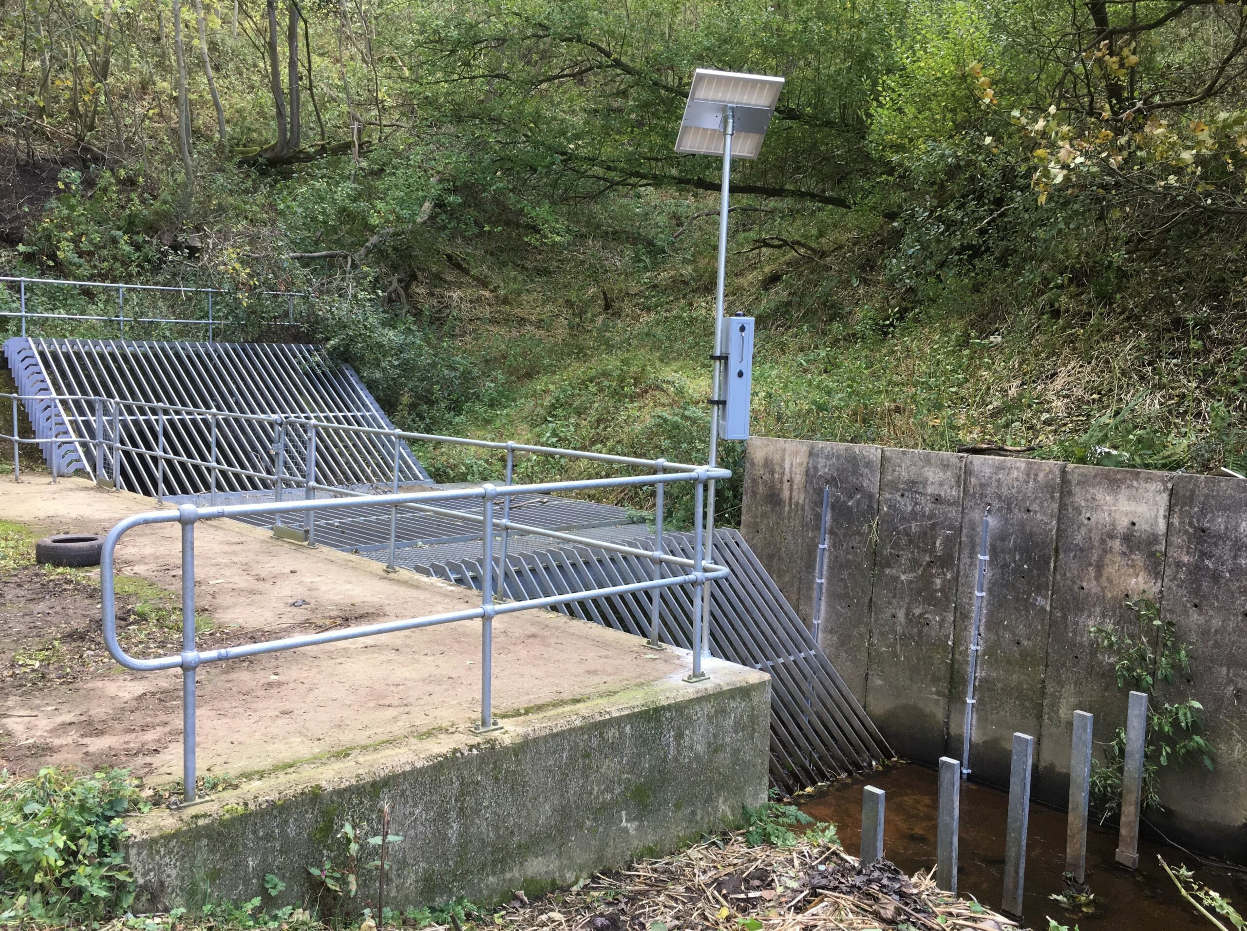 Remote asset monitoring camera installation to view the condition of a trash screen at a culvert which is prone to flooding